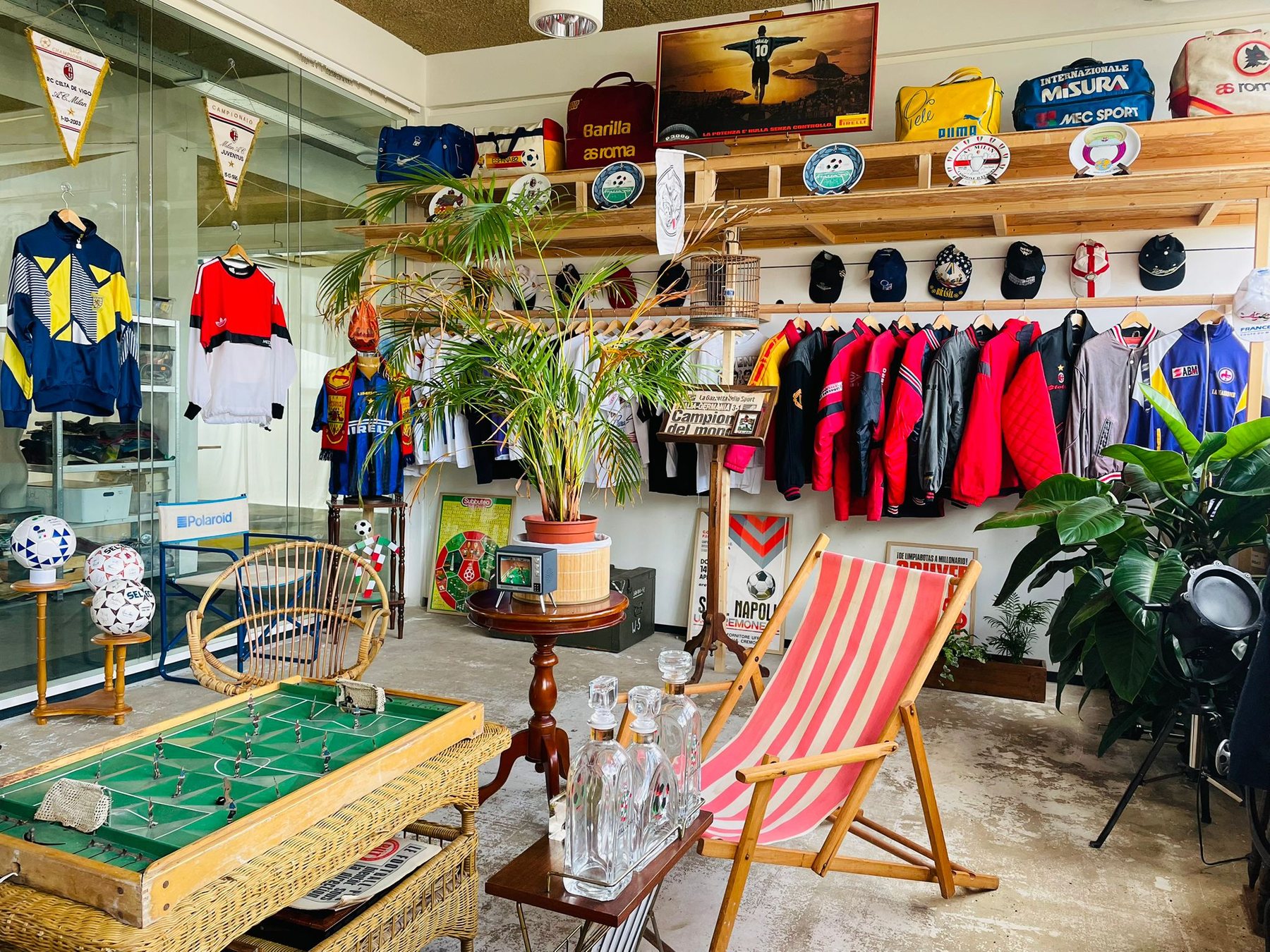 Calcio90 Studios wall with football posters, vintage shirts, coffee machine and Italian football objects