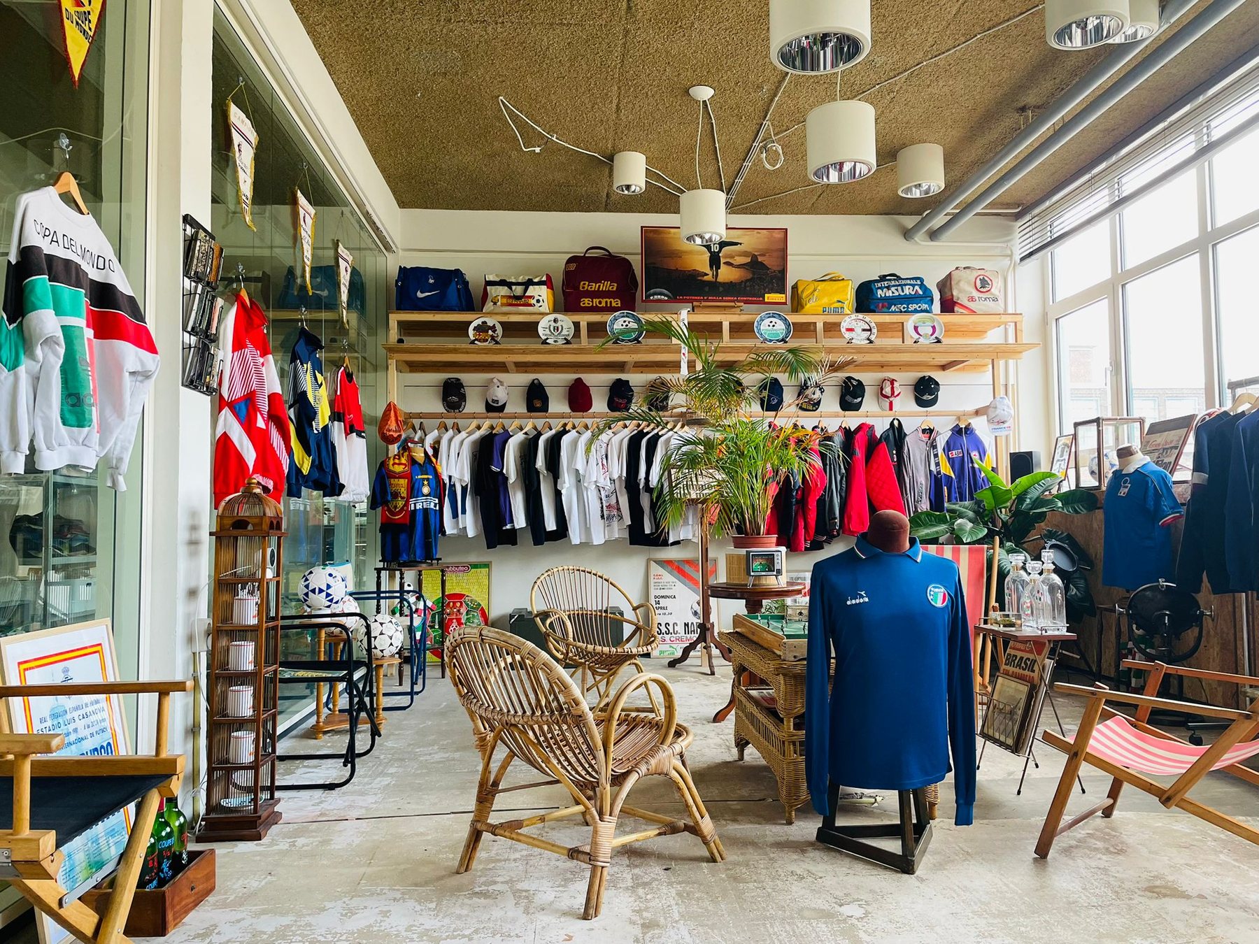Inside Calcio90 Studios with vintage football shirts, chairs, posters and archive objects